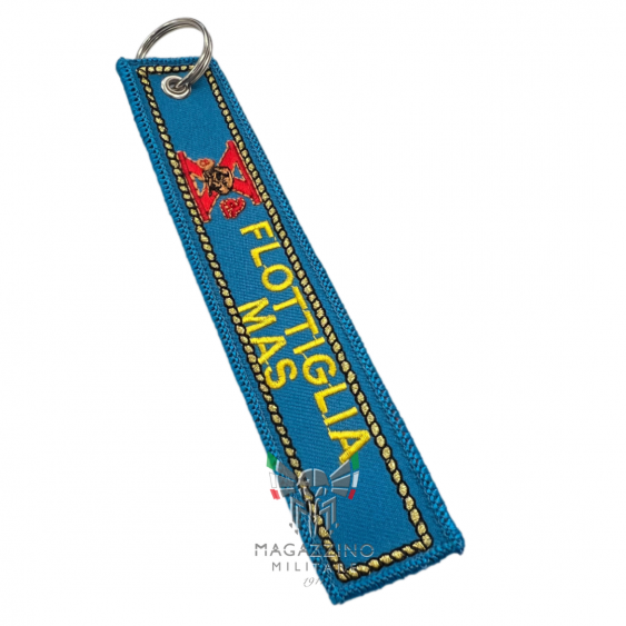 Embroidered keychain "X FLOTTIGLIA MAS", size 13cm x 2.5cm, light blue background.