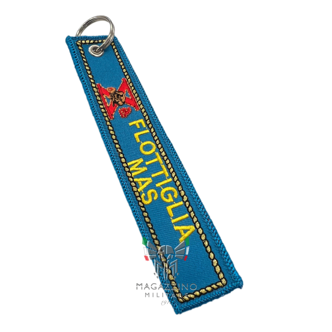 Embroidered keychain "X FLOTTIGLIA MAS", size 13cm x 2.5cm, light blue background.